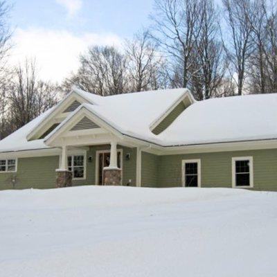 Glen Arbor new home with snow   